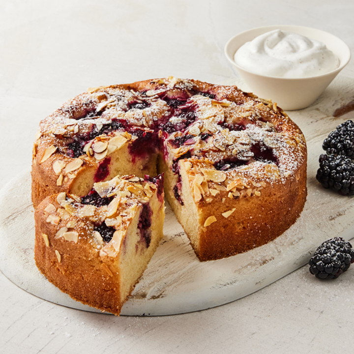 Soft cake with blackberries and almond flakes